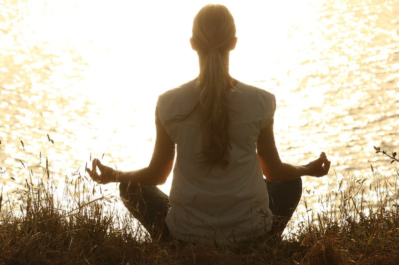 Woman practicing yoga in nature
